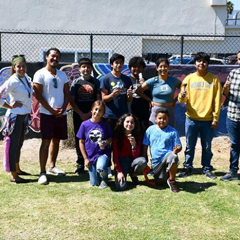 students and Stephanie Arguera at new IV murals