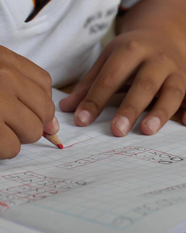 closeup of child working on math problem 