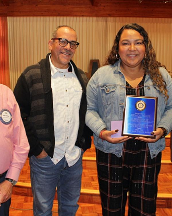 Verónica Ramos with Rotary Club member Dan Herlinger, Adelante Principal Javier Bolívar, and Rotary Club member Michael Baker 