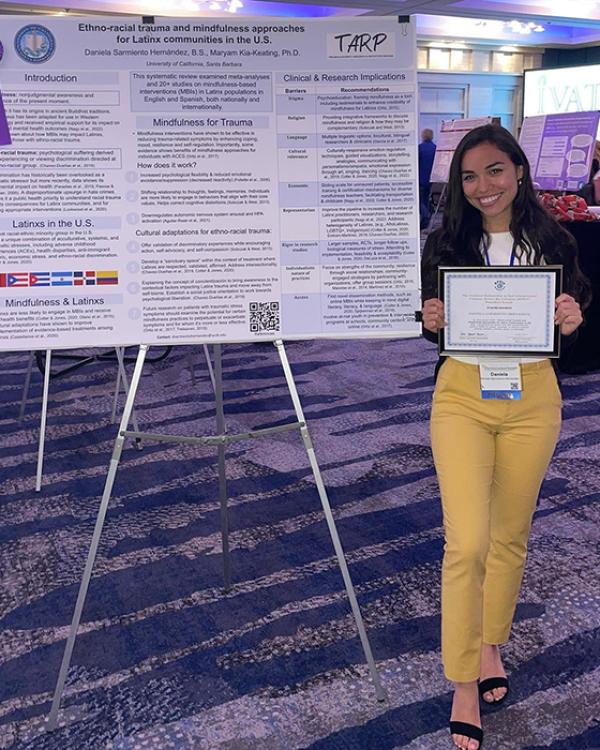 Daniela Sarmiento with NPEIV award-winning poster 